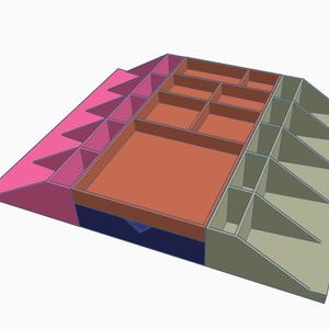 Può includere: Un organizer multi-scomparto dal design geometrico. L'organizer presenta una combinazione di colori rosa, arancione, blu e verde. Ha scomparti di varie dimensioni e lati angolati, adatti per riporre piccoli oggetti. Il design è moderno e funzionale.