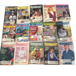 May include: A collection of fifteen vintage Workbasket magazines featuring various craft projects, knitting patterns, and crochet designs on their covers. Each issue displays colourful photography of people wearing handmade sweaters and seasonal home decor items.