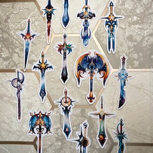 May include: A set of 15 colourful sword and axe stickers with a galaxy theme. The stickers feature a variety of designs, including swords with stars, moons, and planets. The stickers are perfect for adding a touch of fantasy to any surface.