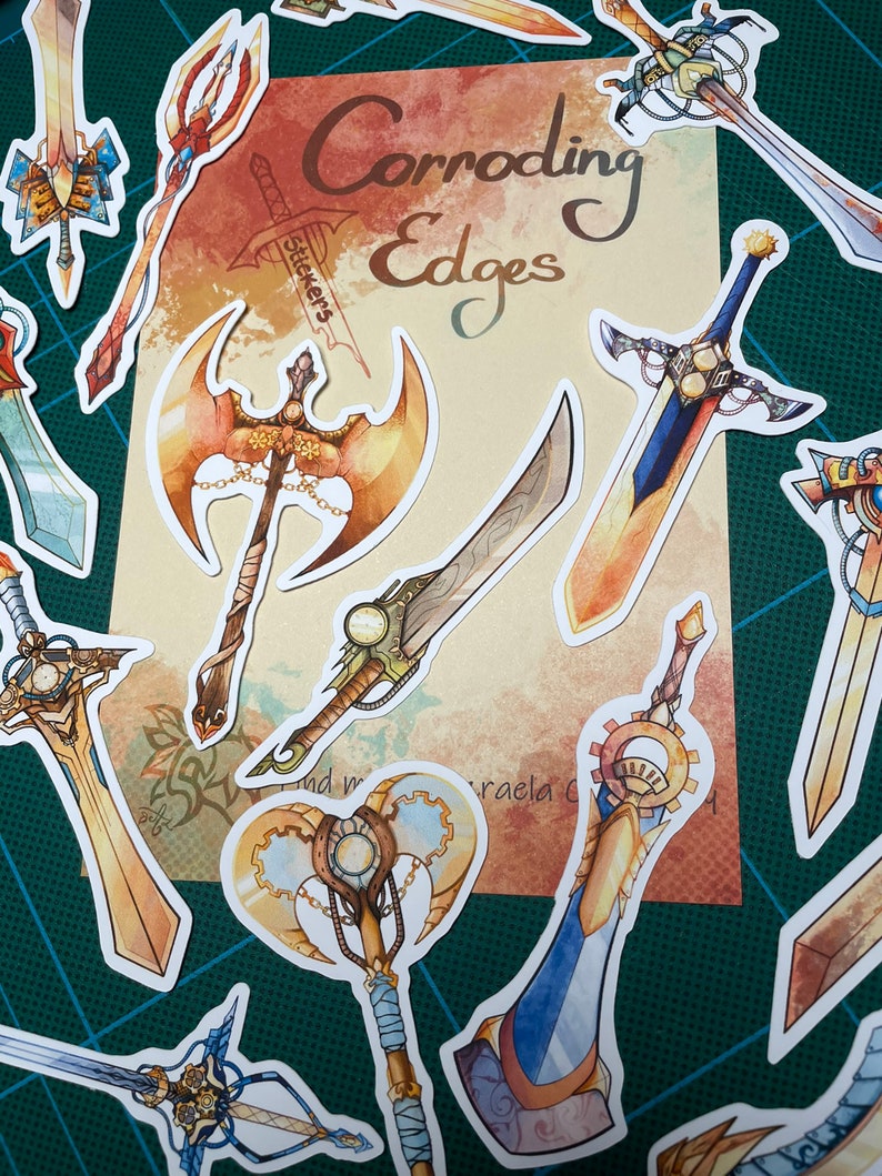 May include: A set of 10 colorful stickers featuring various fantasy weapons with intricate details. The stickers are designed with a steampunk aesthetic and feature gears, chains, and other mechanical elements. The stickers are labeled "Corroding Edges Stickers".