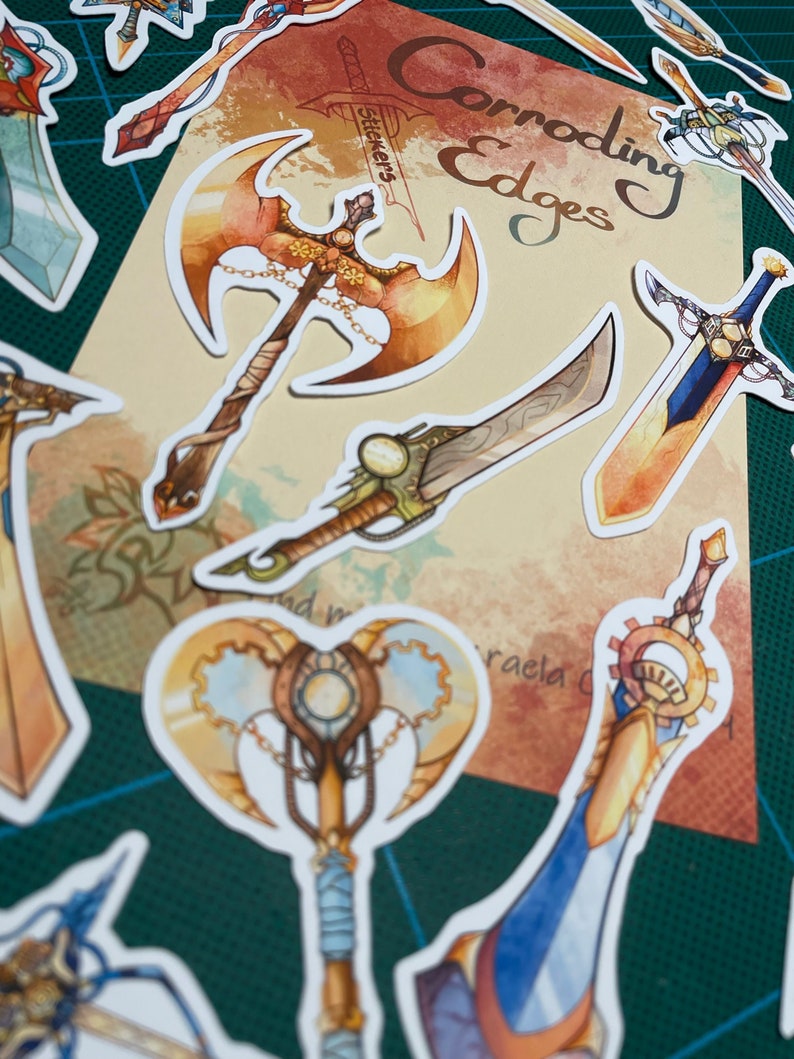 May include: A set of colorful stickers featuring various fantasy weapons with intricate details. The stickers are labeled "Corroding Edges Stickers".