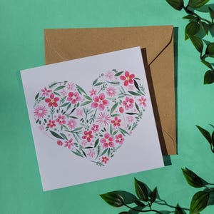 Vierkante wenskaart met bloemenhart
