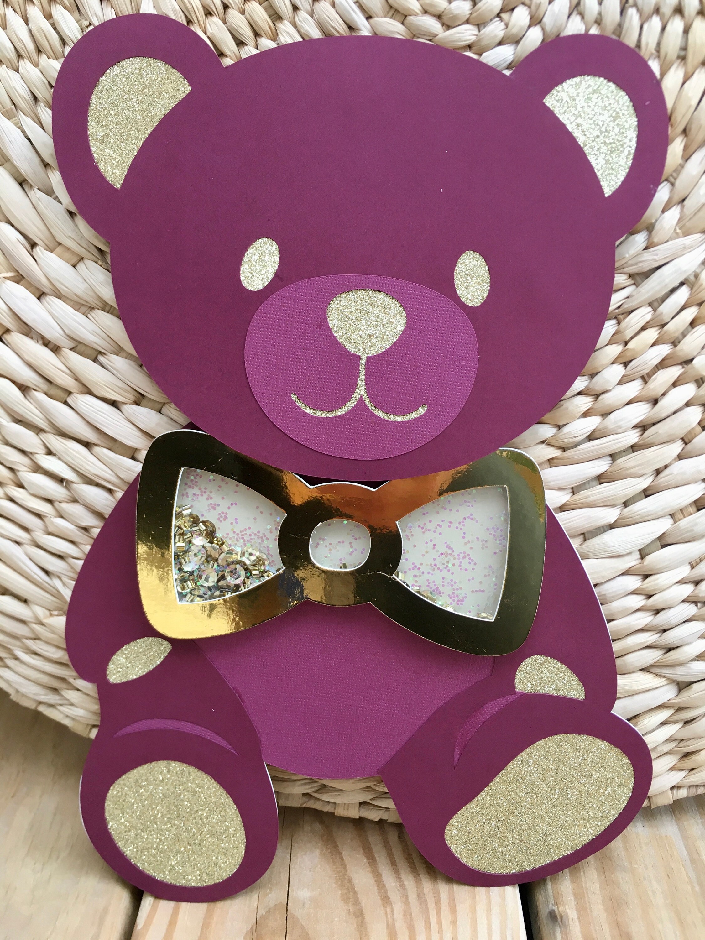 teddy bear with purple bow tie