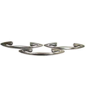 May include: A set of three ceramic mugs with a speckled, matte finish. The mugs are in shades of cream, light gray, and dark gray. Each mug has a simple, minimalist design and a rounded handle.