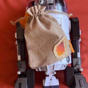 Plecak typu crossbody Droid ze ściągaczem - kolor beżowy z wzorem meiloorun