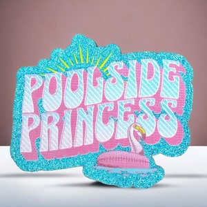 May include: A blue and pink glitter patch with the text "Poolside Princess" in a retro font. A pink flamingo pool float is in the bottom right corner of the patch.