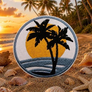 May include: Circular embroidered patch featuring a tropical sunset scene. The design includes black palm trees, a yellow sun, and blue ocean waves, all set against a white background. The patch is likely for clothing or accessories.