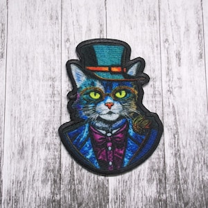 May include: A blue and green cat wearing a top hat and a bow tie. The cat has a moustache and glasses. The background is a wood grain pattern.