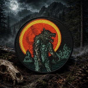 May include: A circular embroidered patch featuring a dark, furred werewolf figure standing in profile against a large, vibrant orange and yellow full moon. The design includes dark green forest silhouettes and a black border, rendered in detailed thread.