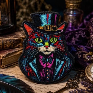 May include: An embroidered patch featuring a cat wearing a top hat, a tuxedo jacket, and a bow tie. The design uses vibrant colors including neon blue, red, green, and purple threads against a black background, creating a detailed portrait.