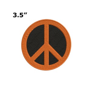 May include: A 3.5 inch orange peace sign patch with a black centre.
