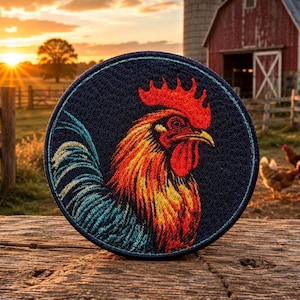 May include: A circular embroidered patch featuring a detailed rooster head in profile. The rooster has a bright red comb and wattle, with golden-yellow and orange neck feathers, and dark blue tail feathers set against a dark navy blue background.