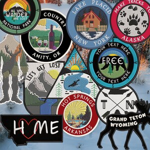 May include: A collection of embroidered patches featuring various designs, including a bear, a moose, a cabin, mountains, and a lake. The patches are all different colours and have a variety of text on them, such as "Let's Get Lost", "Hot Springs Arkansas", and "Make Tracks to Alaska".