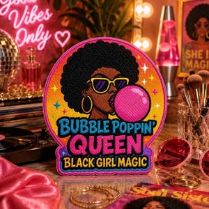 May include: A circular embroidered patch featuring a person with an afro hairstyle wearing yellow sunglasses and blowing a pink bubble. The text reads BUBBLE POPPIN' QUEEN BLACK GIRL MAGIC in blue and yellow against an orange and purple background.