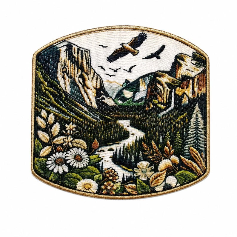 May include: Embroidered patch featuring a scenic mountain landscape with a river, trees, and flying birds. The patch has a gold border and includes detailed depictions of flowers and foliage. The design evokes a sense of nature and adventure.