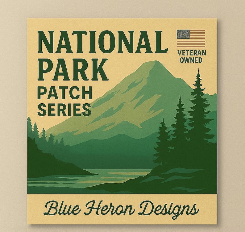 May include: A square, vintage-style print with the words "NATIONAL PARK PATCH SERIES" in dark green. The image features a mountain landscape with trees and water, and the text "Blue Heron Designs" at the bottom. A small American flag and the words "VETERAN OWNED" are in the upper right corner.