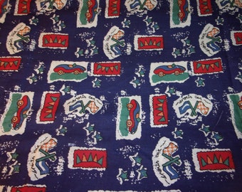 May include: Blue fabric with a repeating pattern of red, white, and green sports cars, flags, and stars. The text "sports car" is repeated throughout the pattern.
