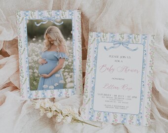 May include: A blue and pink baby shower invitation with a floral pattern. The invitation says "Please join us for a Baby Shower honoring Lillian Rose. Saturday 08 July at 2 PM 12 Spring Meadow Lane Sunnyville Arkansas AR 00000 Lillian is registered at Amazon and Target."