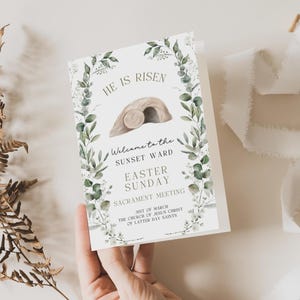 May include: A white Easter Sunday card with the text "He is Risen" and "Welcome to the Sunset Ward". The card features a watercolor illustration of a tomb and is decorated with green foliage. The card also includes the date "31st of March".