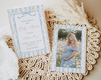 May include: A blue and white baby shower invitation with a floral pattern and a photo of a pregnant woman in a blue dress. The invitation says "Please join us for a Baby Shower honoring Lillian Rose".