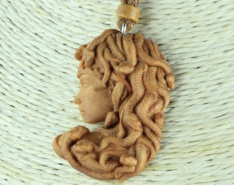 Hand Carved Wood Medusa Necklace on Adjustable Cord with Ceramic Bead