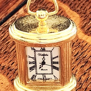 Vintage Miniature Clock (not sure if it works could not figure out how to wind or open- Sorry)