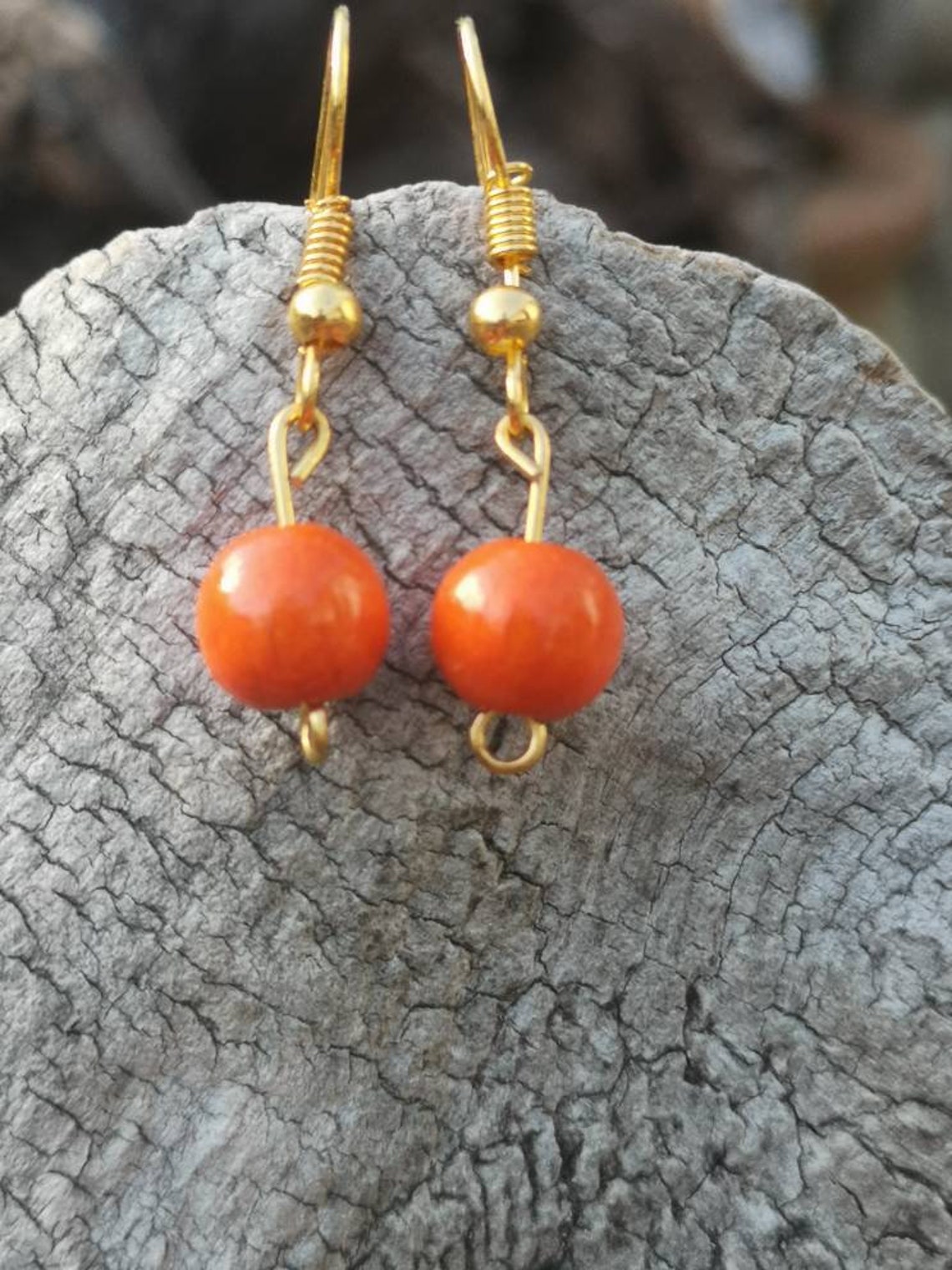 Bright orange wooden beaded drop dangly earrings. Etsy