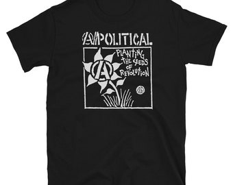 May include: Black t-shirt with a white graphic of a stylized flower with an anarchy symbol in the center. The text "Apolitical" and "Planting the seeds of revolution" is printed on the shirt.
