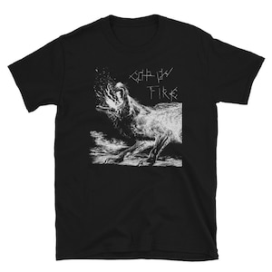 May include: Black t-shirt with a white graphic of a wolf howling at the moon. The text "CRY FIRE" is printed above the wolf.