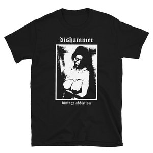 May include: Black t-shirt with a white graphic of a woman with the text "dishammer vintage addiction" printed on the front.