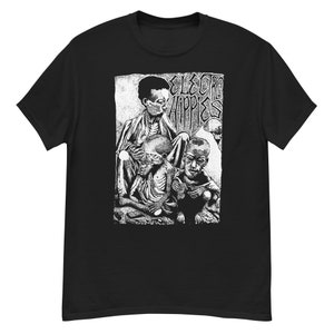 May include: Black and white graphic print t-shirt featuring three figures with the text "Electro Hippies" above them.