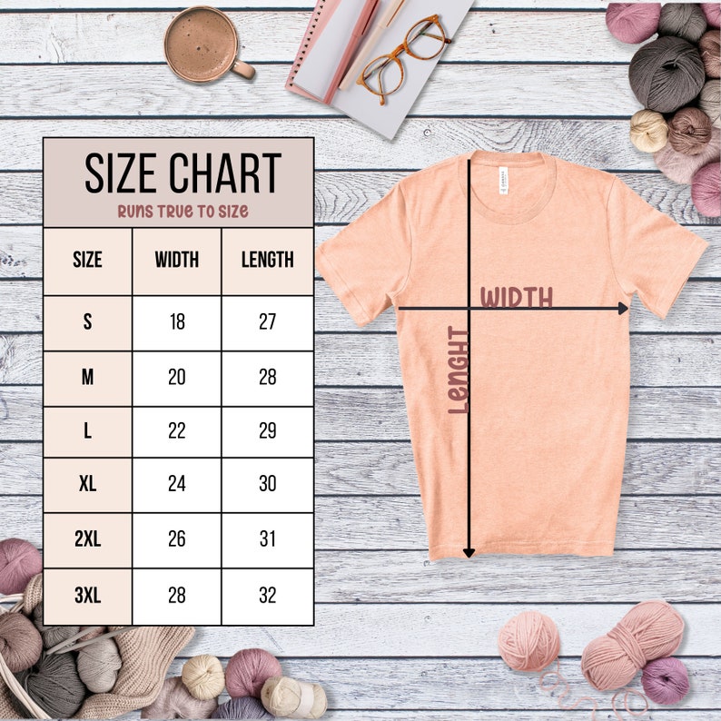 May include: Size chart for a t-shirt with measurements in inches for width and length. The chart shows sizes S through 3XL. The t-shirt is peach colored and is shown on a wooden background.