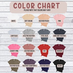May include: Color chart showing 16 different t-shirt colors. The colors are: white, soft cream, heather peach, pink, light blue, athletic heather, steel blue, dark grey heather, charity pink, heather mauve, red, maroon, heather olive, heather team purple, heather navy, and black. The text "COLOR CHART" and "PLEASE NOTE THAT COLORS MAY VARY" is at the top of the chart.