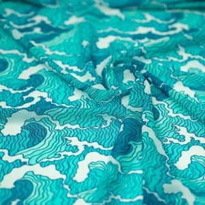 A swirled piece of Crazy Waves Printed Power Mesh