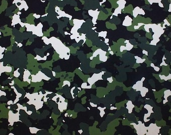 May include: Camouflage pattern fabric with a mix of green, black, and white colors. The pattern is abstract and resembles a woodland scene.
