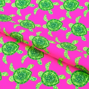 May include: A vibrant pink fabric featuring a repeating pattern of sea turtles. Each turtle is rendered in shades of lime and forest green with intricate floral-like mandala designs on their shells and patterned flippers in a consistent layout.