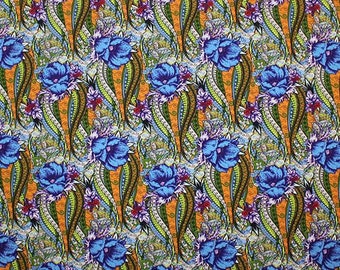 May include: A repeating pattern of blue flowers on a bright orange background. The flowers are stylised and have a paisley-like design. The background is filled with a swirling pattern of green, blue, and white.