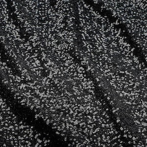 May include: Black fabric with a scattered pattern of small, silver sequins.