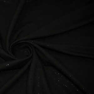 May include: Black fabric with a subtle sparkle. The fabric is soft and has a slight sheen.