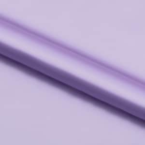 May include: A smooth, silky fabric in a light purple colour. The fabric is folded in a diagonal line, creating a soft, flowing texture.