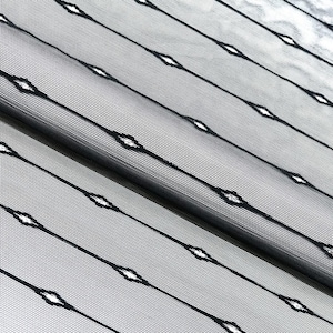 May include: Black sheer fabric with a diamond pattern. The fabric is folded in half, showing the pattern on both sides.