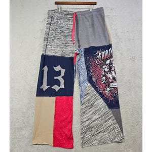 May include: Wide-leg lounge trousers featuring a patchwork design with various fabrics including grey heather, navy blue with a white number 13, tan, red with white dots, and a graphic print of skulls with the text Friday the 13th and Jason.