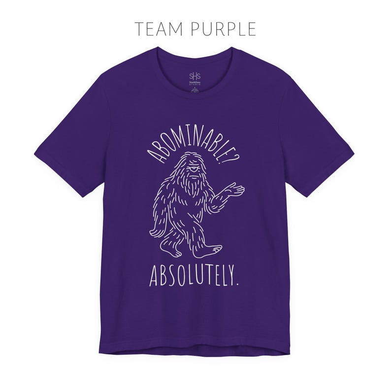 Abominable? Absolutely Yeti Tee | Funny Bigfoot Shirt | Cryptid Top | Unisex Jersey Tee Team Purple