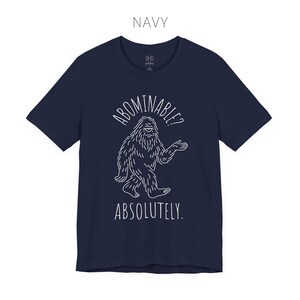 Abominable? Absolutely Yeti Tee | Funny Bigfoot Shirt | Cryptid Top | Unisex Jersey Tee Navy