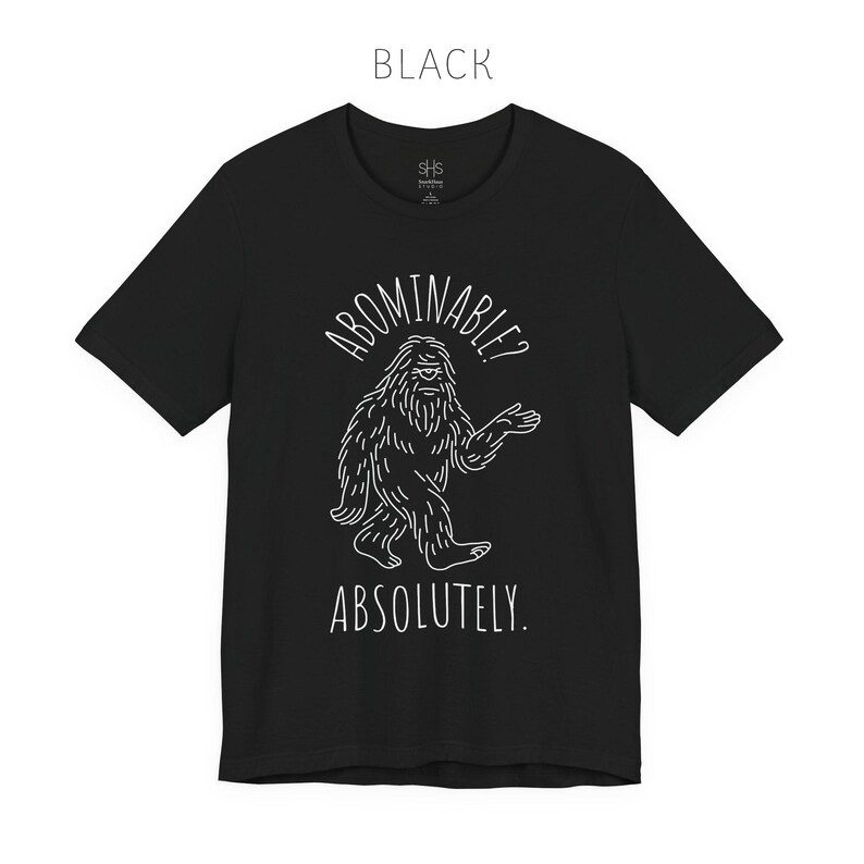 Abominable? Absolutely Yeti Tee | Funny Bigfoot Shirt | Cryptid Top | Unisex Jersey Tee Black