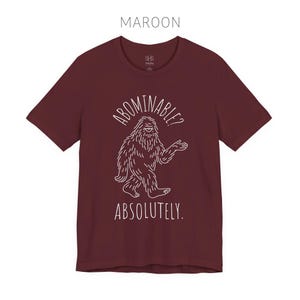 Abominable? Absolutely Yeti Tee | Funny Bigfoot Shirt | Cryptid Top | Unisex Jersey Tee Maroon