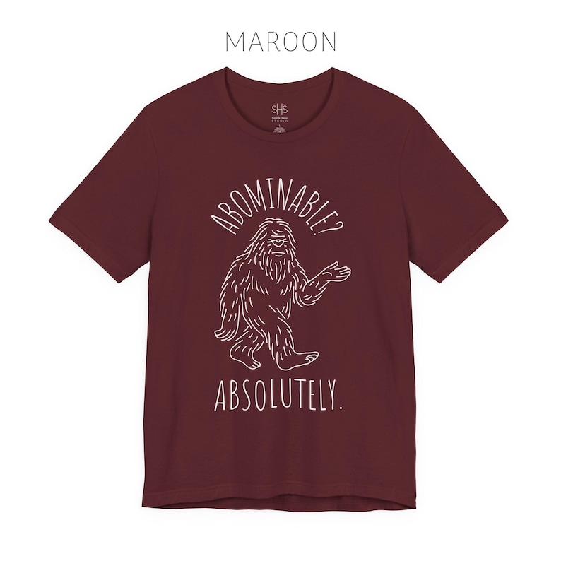 Abominable? Absolutely Yeti Tee | Funny Bigfoot Shirt | Cryptid Top | Unisex Jersey Tee Maroon