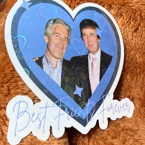 May include: A heart-shaped sticker featuring two men in suits, set against a blue background with hearts and stars. The sticker has the words "Best Friends Forever" in a cursive font.