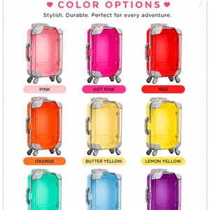 May include: A collection of nine mini suitcases from Miss Tancy Designs in various translucent colors including pink, hot pink, red, orange, butter yellow, lemon yellow, mint green, light blue, and purple, each featuring silver accents and wheels.