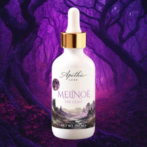 May include: A white glass dropper bottle with a gold collar and white dropper top. The label features the text Apothic LUXE, MELINOË, THE LIGHT, and NET WT. (50 ML), along with a circular moon graphic and a landscape illustration of mountains.